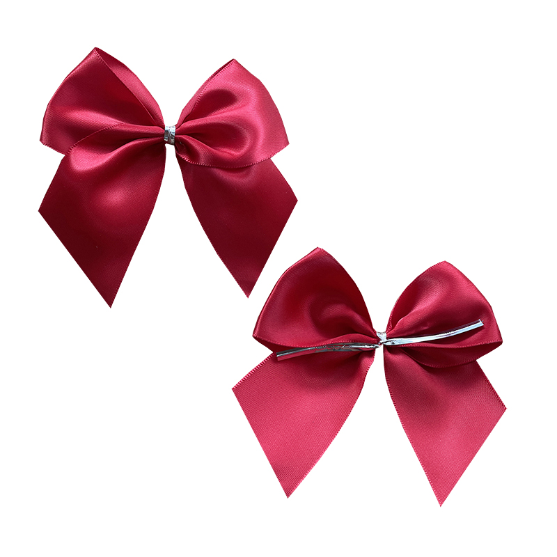 Red satin ribbon bow with silver twist tie for bakery shop