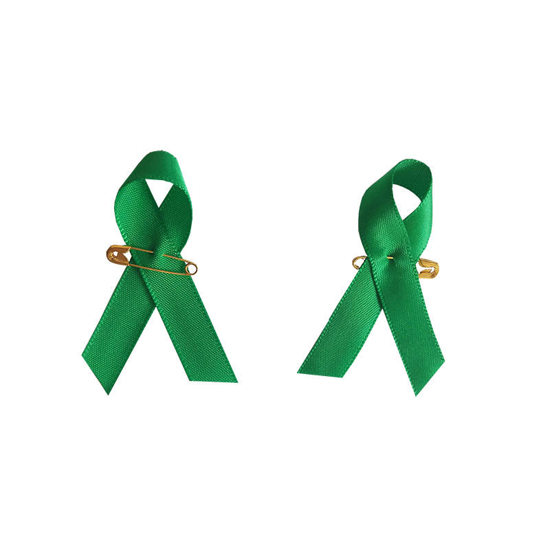 Green awareness ribbon with metal pin for mental health